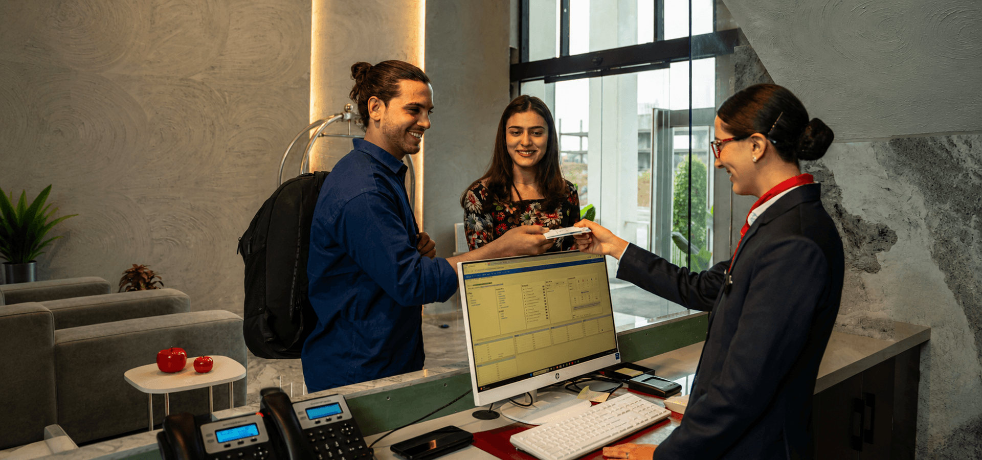 Guests being welcomed at the Alpirious reception desk